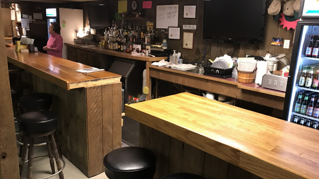 Norco Clubhouse first floor full stocked bar and social area - meet Ruthie the bartender